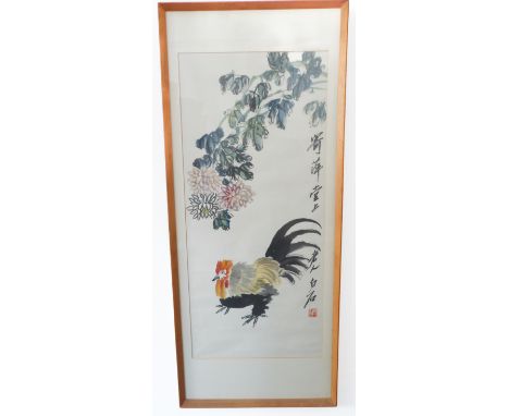 A framed and glazed Chinese watercolour of a rooster beneath hanging peony, signed vertically far right and with red seal mar