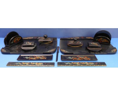 An unusual pair of Japanned desk-sets; each comprising a blotter, letter stand, inkwell, rectangular trays and ruler. Each pi