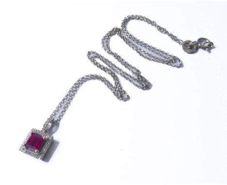 A 14-carat gold, ruby and diamond pendant and chain