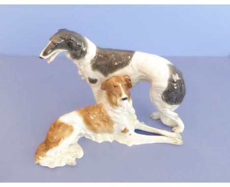 A large continental porcelain model of two Saluki-type dogs; paper label, printed marks and impressed marks to underside (31c