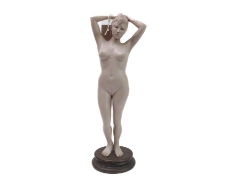 A composition sculpture model of a standing female nude on a circular socle, signed Johnson and dated 01/98 (40cm high)