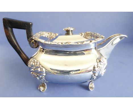 An early 19th century (probably continental) Sheffield-plated teapot raised on four ornately cast foliate-style legs