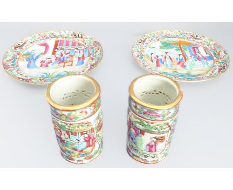 A late 19th century Canton enamelled porcelain set decorated in the famille rose pattern: a pair of vases (11.5cm) and plates