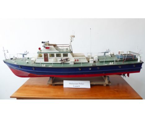 A good custom-built model of a Malaysian Police launch on stand (110cm x 24cm wide)