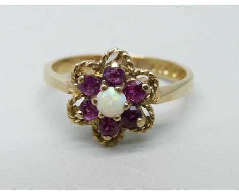 A 9ct gold, ruby and opal ring, Birmingham 1977, 2.4g, M 