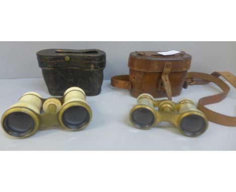 A pair of bone opera glasses and a pair of French mother of pearl opera glasses, both cased 