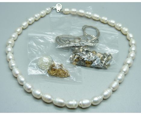 A cultured pearl necklace, a silver necklace and two others 