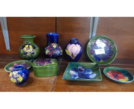 A collection of Moorcroft, three small vases and a miniature vase, diamond shaped pin dish, three circular pin dishes and a t