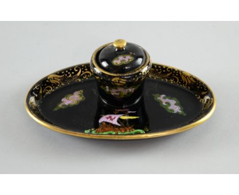 An unusual Maling inkwell, with decoration of a viking ship on a gilt decorated black ground, 18 cm wide 