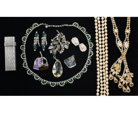 Collection of costume jewellery including an amber ring, two 1950's necklaces and a Dior cigarette lighter 