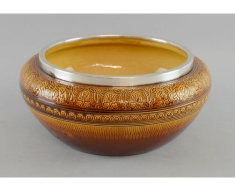  Christopher Dresser a Linthorpe pottery bowl.  Impressed signature to base, with silver rim London 1889 diameter 28cm