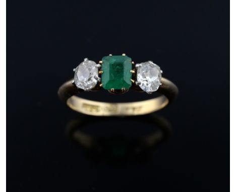 Early 20th Century emerald and diamond three stone ring, square step-cut emerald to the centre weighing approximately 0.60cts