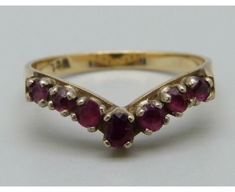 A 9ct gold, seven red stone ring, 2.2g, O 