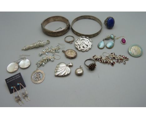 Silver jewellery including two bangles, a hallmarked Victorian brooch, a large lapis lazuli set ring, etc., (garnet ring lack