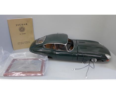 A De Agostini large scale model E Type Jaguar with additional E Type Jaguar booklet, lacking windscreen, contents unchecked, 