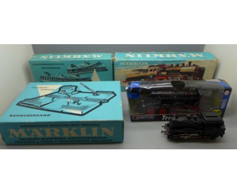 A Marklin locomotive and tender, track, level crossing, boxed and two locomotives 