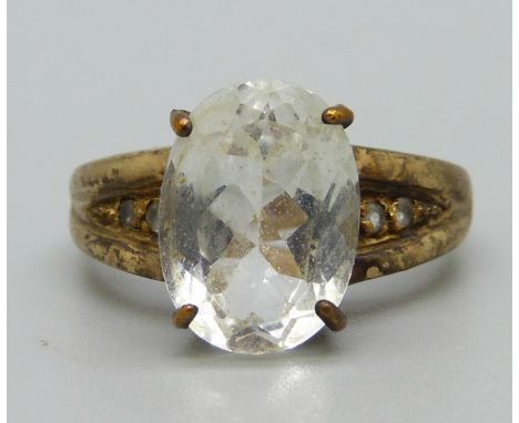 A 9ct gold ring set with a white stone, 6.1g, U 