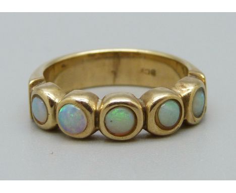 A 9ct gold, five stone opal ring, 4.3g, K 