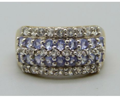 A silver gilt, tanzanite and white stone ring, O 