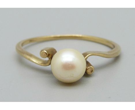 A yellow metal and pearl ring, (tests as 9ct), 1.7g, O 