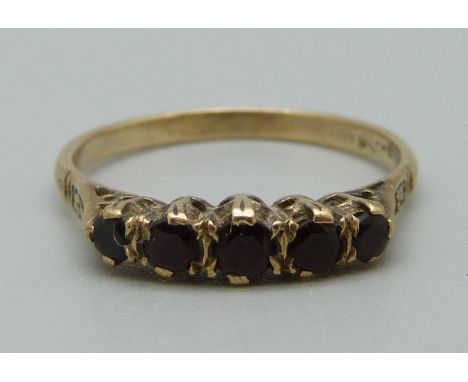 A 9ct gold, five stone garnet ring, 1.6g, M 