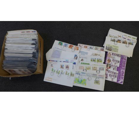 Stamps; a box of GB first day covers and a catalogue 