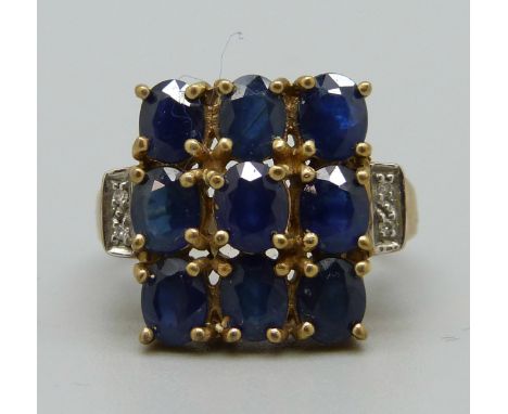 A 9ct gold ring set with blue and white stones, 5.6g, N 