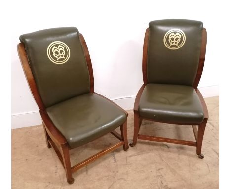 A pair of 19th century mahogany office chairs having green leather back support and seat with MM initials imprinted in gold t