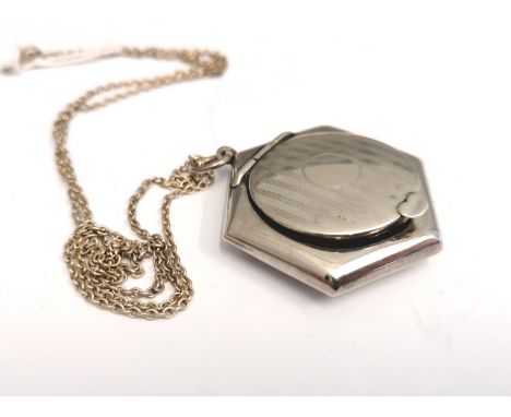 A Birmingham silver rouge compact by Crisford &amp; Norris Ltd dated 1924 having an engine turned design on hinged lid and he