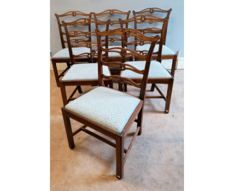 A set of six oak George III ladder back dining chairs having pieced shaped splats over insert seat, raised on square supports