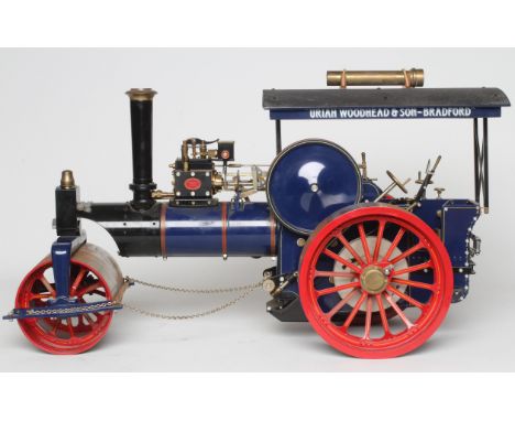 A Maxwell Hemmens 1" scale steam roller, coal fired boiler, single cylinder to gear box, water pump, chain link steering.  Th