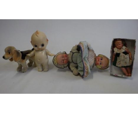 A Knickerblocker rubber and cloth two headed doll with label, 12" long, together with a 1950s Kewpie doll, a Schildkrot doll 