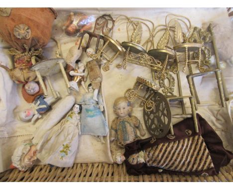 A collection of pre-war dolls house dolls, together with dolls house furniture including a four piece twist wire suite with f