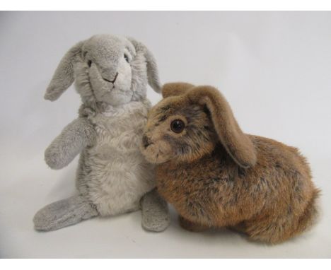 Two Steiff rabbits, one brown on all fours with ear button and label, 13 1/2" across, the second seated in grey, with white m