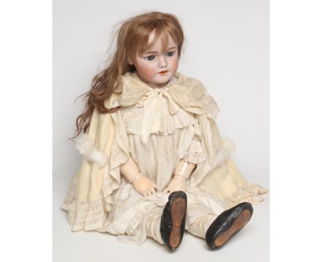 A large Simon &amp; Halbig bisque socket head doll, with blue glass sleeping eyes, open mouth and teeth, pierced ears, light 