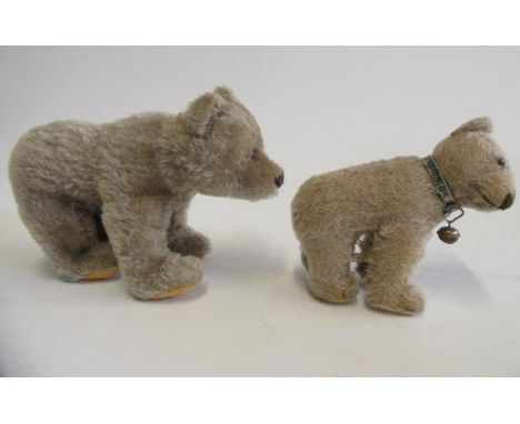 Two Steiff standing bears, the 8" example with sewn nose and mouth, felt pads and metal ear button, the 5 1/2" example with r