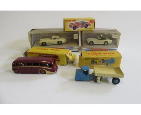 Dinky 281 Luxury Coach, box P, model repainted, reproduction Dinky 111 Triumph, boxed M, 415 Mechanical Horse, box P, model G