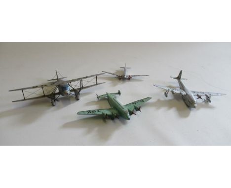 A small scale wooden model of a D.H. Dragon Rapid, possibly by Frog, and three further models by Dinky High Speed monoplane, 