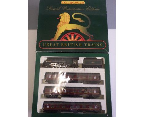 Hornby Train Pack with A4 Guillemot and three B.R. coaches, box AF-E, a playworn lineside building by Hornby and others (Est.