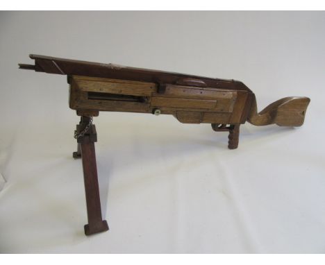 A handmade wooden gun which fires rubber bands with removable bipod, an interesting well made item (Est. plus 21% premium inc