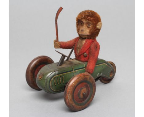 Early Schuco clockwork monkey in tricycle with hockey stick, F, and a clockwork plush covered bird, F-G (2) (Est. plus 21% pr