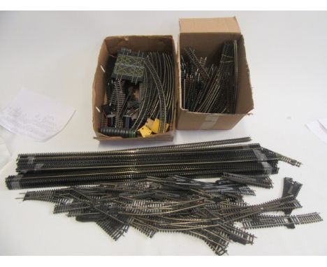 A large quantity of OO gauge track and points by Hornby, Peco and others including set track, electric points and 35 metres o