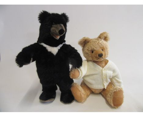 A Steiff black bear standing on it's hind legs, with black button eyes, ear button and label, 20 1/2" tall, together with a S