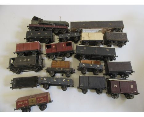 Eighteen coarse scale three rail O gauge goods wagons, some of wood construction by C.B. Smith, others by Leeds, F-P (Est. pl