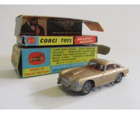 Corgi 261 James Bond Aston Martin DB5, boxed with instructions and spare passenger, box F, vehicle some paint rubbing to roof