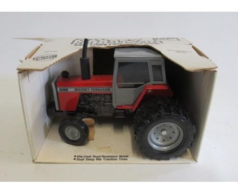 ERTL Massey Ferguson 698 tractor finished in red/silver, boxed, E (Est. plus 21% premium inc. VAT)