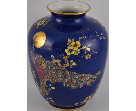 A George Jones & Sons blue glazed vase with hand-painted gilt and enamel peacock motif decoration. H. 27cm