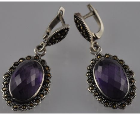 A pair of silver antique style amethyst and marcasite earrings
