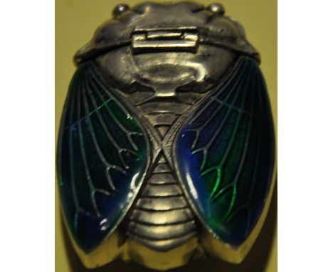 A white metal scarab beetle vesta case with enamel wings