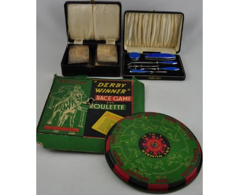 A pair of cased silver backed brushes together with a cased enamelled manicure set and a vintage Chad Valley Derby Winner tin